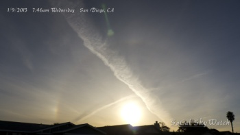 7:46am Morning sun crossed with massive chemtrail plumes with solar halo and sun dog.