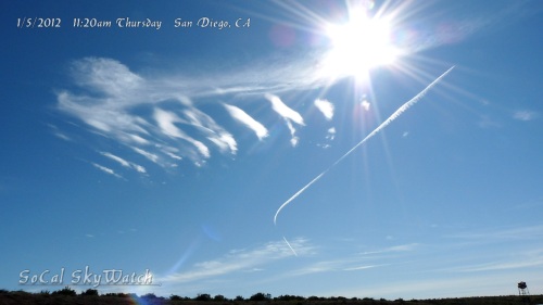 1/5/2012 San Diego 11:20am - "Boomerang" shaped chemtrail next to HAARP wave cloud formation.