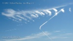 1/5/2012 San Diego 11:25am - "Boomerang" shaped chemtrail next to HAARP wave cloud formation.