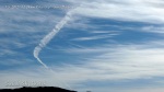1/5/2012 San Diego 12:24pm - Expanding boomerang shaped chemtrail.