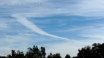 1/5/2012 San Diego 12:37pm - Massive expanding boomerang shaped chemtrail.