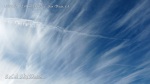1/5/2012 San Diego 12:41pm - Fresh chemtrail line next to expanded chemtrail in stringy cloud cover.
