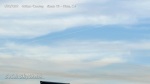 1/10/2012 Vista 4:18pm - Curved "boomerang" chemtrail sprayed over cloud cover as brown pollution haze forms below.