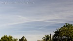 9:11am Rows of chemtrail line clouds in all directions.