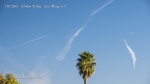 Two more planes in various stages of spraying line segments across expanded fake clouds.