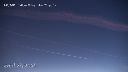 Multiple planes continue spraying after sundown.